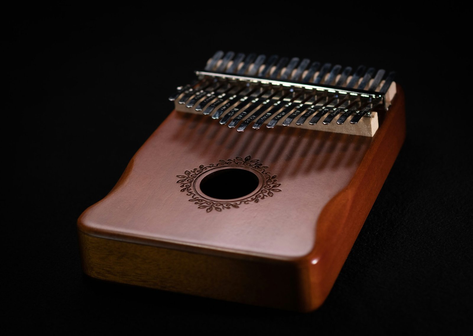 a close up of a musical instrument on a black background